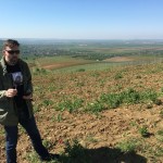 Peter drinking Feteasca Neagre on Minis hill vineyard